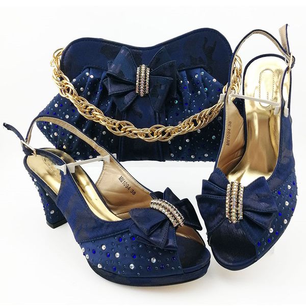 Hot sale D.blue women pumps match handbag with rhinestone bowtie style african dress shoes and bag set MM1094,heel 9CM
Hot sale D.blue women pumps match handbag with rhinestone bowtie style african dress shoes and bag set MM1094,heel 9CM