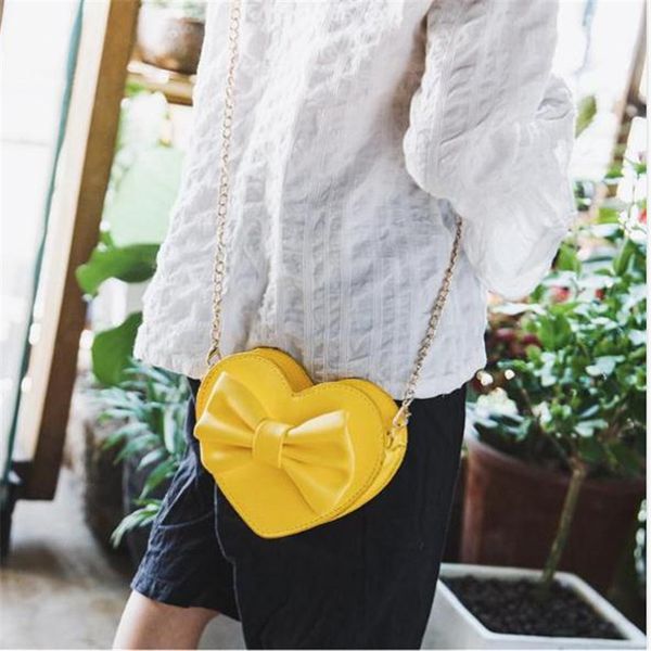 women handbags new solid color pu leather heart shaped cross body bags fashion female traveling bowknot chain shoulder packs hot
women handbags new solid color pu leather heart shaped cross body bags fashion female traveling bowknot chain shoulder packs hot