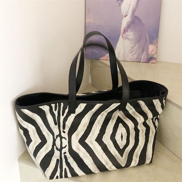 designer handbag zebra pattern portable new women's bag in large capacity travel single shoulder fashion versatile tote bag 1
designer handbag zebra pattern portable new women's bag in large capacity travel single shoulder fashion versatile tote bag 1
