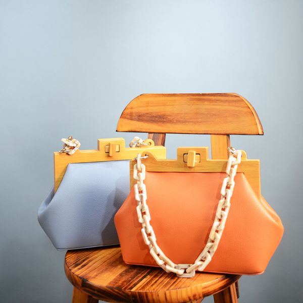 luxury acrylic chain women's handbags wooden clip crossbody bags for women designer pu leather ladies hand bags sac
luxury acrylic chain women's handbags wooden clip crossbody bags for women designer pu leather ladies hand bags sac