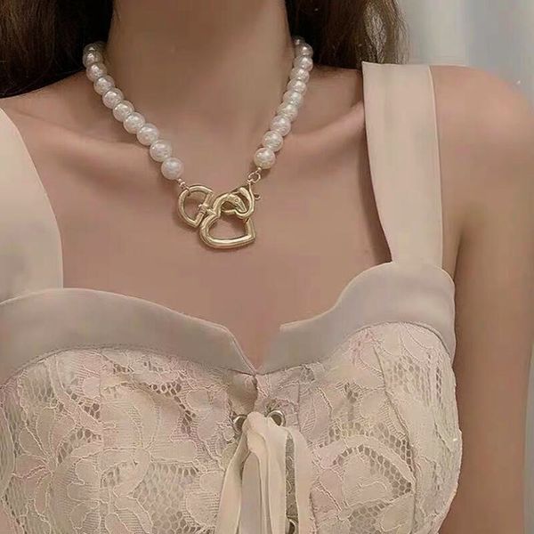 new design long chain choker necklace big imitation pearl & heart rhinestone necklace for women shiny silver color metal necklac
new design long chain choker necklace big imitation pearl & heart rhinestone necklace for women shiny silver color metal necklac