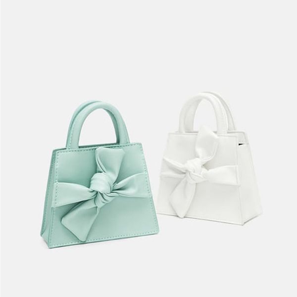 fashion bow mini women's handbag simple pu solid color women purses and handbags wild trapezoid ladies shoulder messenger bags
fashion bow mini women's handbag simple pu solid color women purses and handbags wild trapezoid ladies shoulder messenger bags