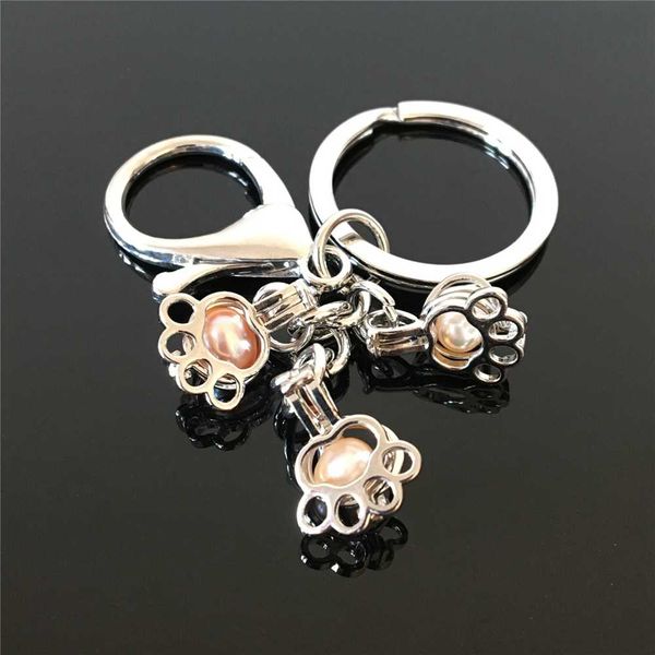 euro-american paw print pearl cage key ring can open hollow noctilucent volcanic stone pendant keyring, Silver
euro-american paw print pearl cage key ring can open hollow noctilucent volcanic stone pendant keyring, Silver