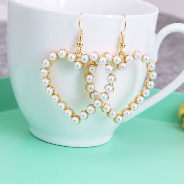 women sweet wild love earrings gold silver alloy hollow artificial pearl earrings ladies 925 needles simple creative wedding earrings
women sweet wild love earrings gold silver alloy hollow artificial pearl earrings ladies 925 needles simple creative wedding earrings