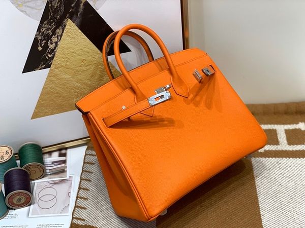 wholesale half handmade original epsom leather orange design handbag25cm,wax thread,have both gold and silver hardware,fast delivery
wholesale half handmade original epsom leather orange design handbag25cm,wax thread,have both gold and silver hardware,fast delivery