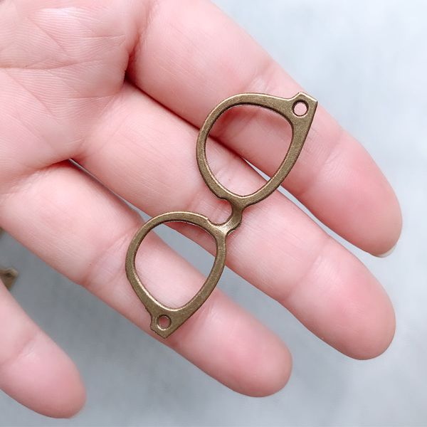 6pcs/lot 50mm bronze metal glasses pendants with 2 holes for earrings necklace bracelet jewelry making ornaments accessories, Blue;slivery 
6pcs/lot 50mm bronze metal glasses pendants with 2 holes for earrings necklace bracelet jewelry making ornaments accessories, Blue;slivery