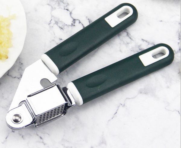 minced pressure stainless steel plastic more function a press mashed garlic organ 
minced pressure stainless steel plastic more function a press mashed garlic organ