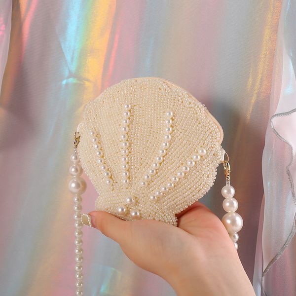 mini girls shell shape pearl chain bag women beads messenger bag handmade money purses sequins feminia handbags vintage
mini girls shell shape pearl chain bag women beads messenger bag handmade money purses sequins feminia handbags vintage