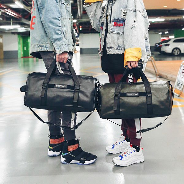 large capacity sports bag fitness travelling bag portable travel duffel 
large capacity sports bag fitness travelling bag portable travel duffel