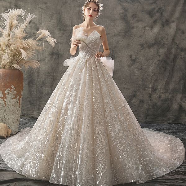 exquisite strapless lace sequin wedding dress bling tulle luxury bridal dress with chic bow wedding dress bridal gowns with court train, White
exquisite strapless lace sequin wedding dress bling tulle luxury bridal dress with chic bow wedding dress bridal gowns with court train, White