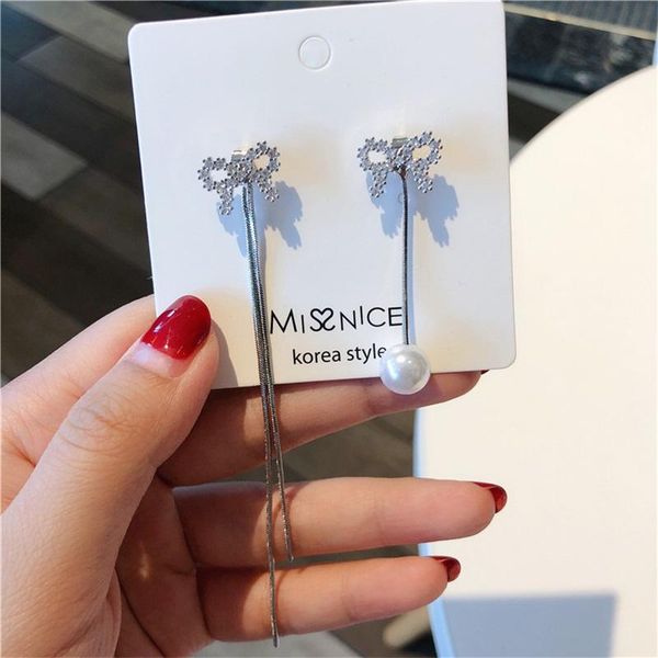 925 silver needle korean quality micro inlaid zircon tassel sesy earrings bohemian bow pearl asymmetrical chain women's earrings
925 silver needle korean quality micro inlaid zircon tassel sesy earrings bohemian bow pearl asymmetrical chain women's earrings