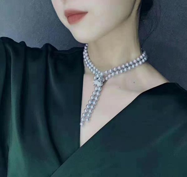 hand knotted 10mm gray shell pearl necklace micro inlaid zircon button sweater chain long 105-110cm fashion jewelry, Silver
hand knotted 10mm gray shell pearl necklace micro inlaid zircon button sweater chain long 105-110cm fashion jewelry, Silver