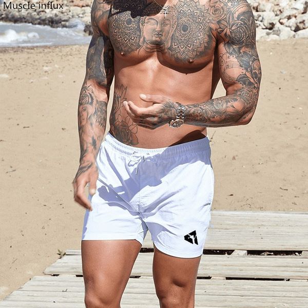 2019 men's quick-drying breathable shorts drawstring loose summer beach male workout training brand short pants, White;black
2019 men's quick-drying breathable shorts drawstring loose summer beach male workout training brand short pants, White;black