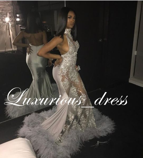 backless silver grey lace mermaid african prom dresses with feathers train halter illusion applique beaded party gala dress, Black
backless silver grey lace mermaid african prom dresses with feathers train halter illusion applique beaded party gala dress, Black