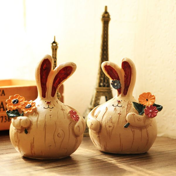 2x mini rabbit w/flower in hand figurine for tabledecor 
2x mini rabbit w/flower in hand figurine for tabledecor