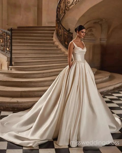 Luxury Satin A Line Dress Spaghetti Strap Cowl Neckline Beaded Detail Bridal Gown With Pockets For Classic Ballroom Wedding