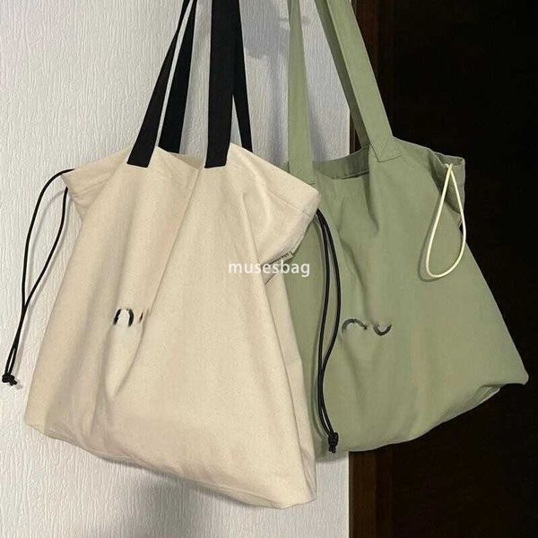 Korean women's high-quality and fashionable large looking tote bag with a lazy style and simple drawstring canvas shoulder bag universal bag for class, trendy, Green
Korean women's high-quality and fashionable large looking tote bag with a lazy style and simple drawstring canvas shoulder bag universal bag for class, trendy, Green
