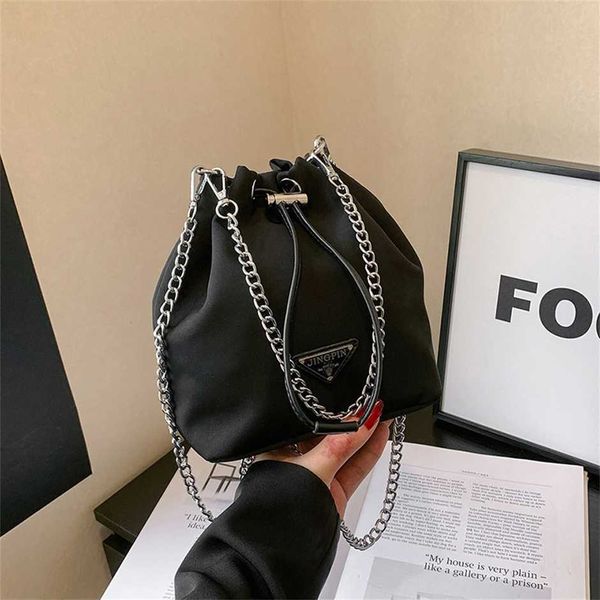 triangle nylon canvas mini niche bucket double chain drawstring single shoulder handbag female letter bag 50% off wholesale
triangle nylon canvas mini niche bucket double chain drawstring single shoulder handbag female letter bag 50% off wholesale