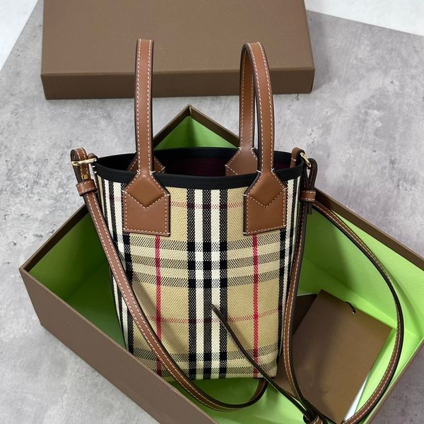 designer bag fashion ladies handbag a compact tote bag in check cotton canvas finished with an adjustable strap to style as a crossbody
designer bag fashion ladies handbag a compact tote bag in check cotton canvas finished with an adjustable strap to style as a crossbody