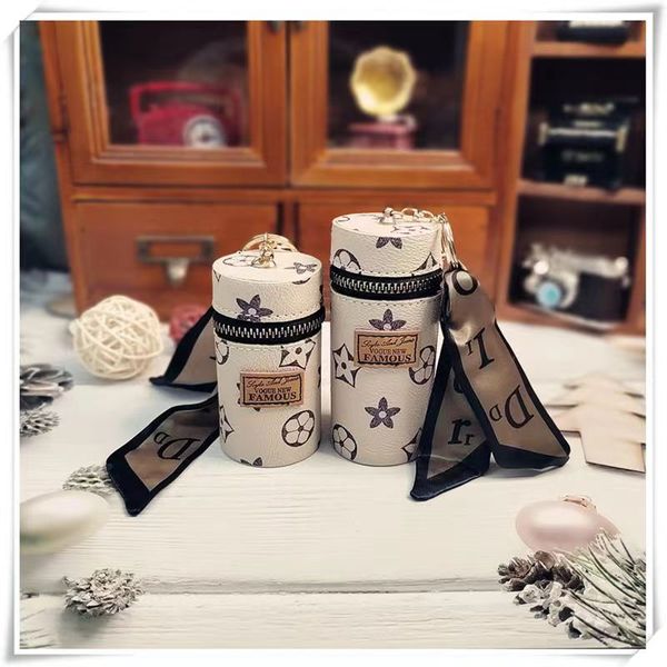 designer keychain lipstick cup pendant key chain can hold large capacity ribbon letters portable car pendant metal fashion personality creat, Silver
designer keychain lipstick cup pendant key chain can hold large capacity ribbon letters portable car pendant metal fashion personality creat, Silver