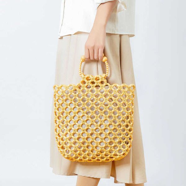 fashion hollow wooden beading women handbag designer handmade large tote bag summer beach round handle hand bags big bali purse 230129
fashion hollow wooden beading women handbag designer handmade large tote bag summer beach round handle hand bags big bali purse 230129
