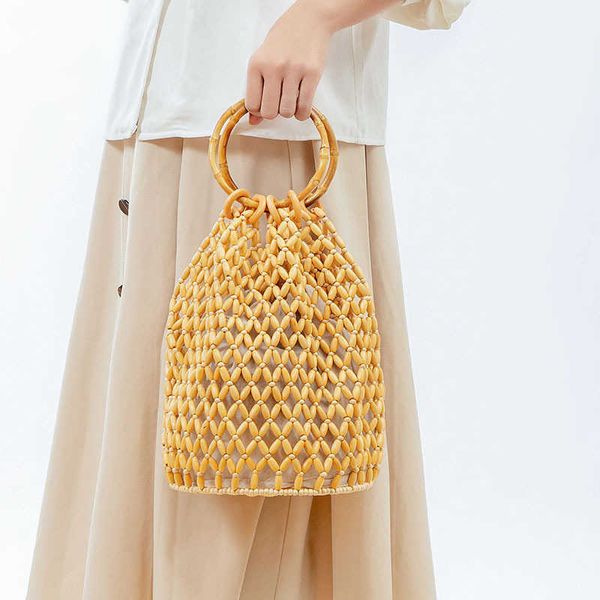 fashion hollow beading women handbags wooden round handle hand bags handmade summ beach bag large tote holiday purses 2023 sac 230129
fashion hollow beading women handbags wooden round handle hand bags handmade summ beach bag large tote holiday purses 2023 sac 230129