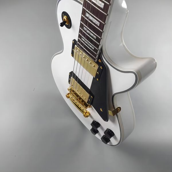 custom electric guitar made of mahogany white glitter imported paint gold accessories available369
custom electric guitar made of mahogany white glitter imported paint gold accessories available369