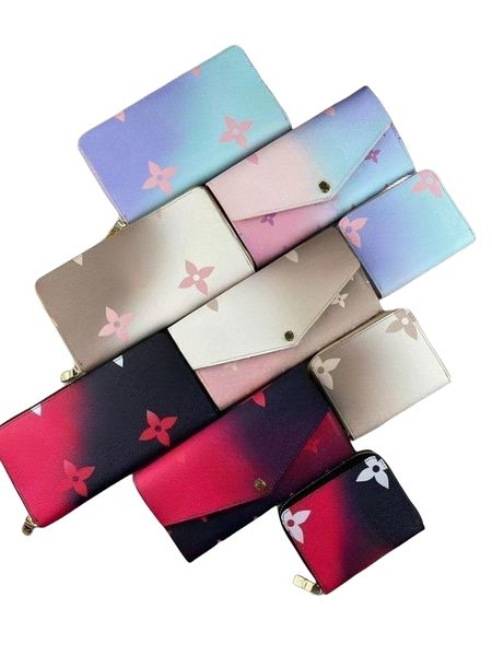the new gradient colored wallet features a soft leather lining, a card clip zipper coin pocket, and a cash compartment, Red;black
the new gradient colored wallet features a soft leather lining, a card clip zipper coin pocket, and a cash compartment, Red;black