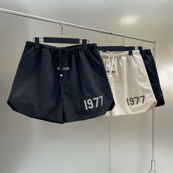 fashion high street brand new essentils sports shorts 1977 reflective print oversize hip hop loose nylon, Black
fashion high street brand new essentils sports shorts 1977 reflective print oversize hip hop loose nylon, Black