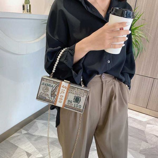 new fashion creative personality inlaid diamond dollar figure pearl chain hand bag lady s foreign style messenger 230804
new fashion creative personality inlaid diamond dollar figure pearl chain hand bag lady s foreign style messenger 230804