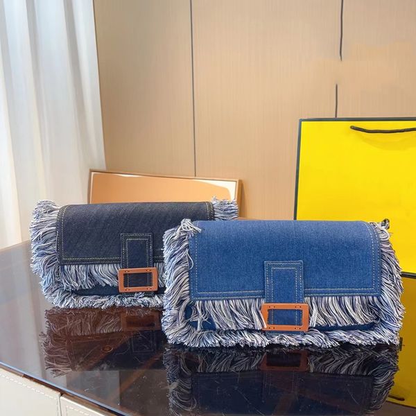 blue denim fringed baguette designer bags shoulder strap and detachable handle zipped pocket palladium finish metal accessories no18
blue denim fringed baguette designer bags shoulder strap and detachable handle zipped pocket palladium finish metal accessories no18