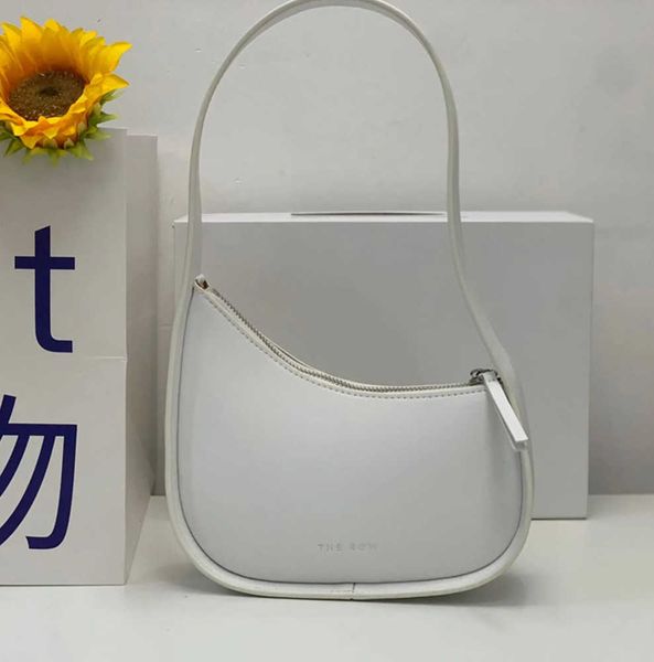 the row half moon bag in smooth leather women designer with flat shoulder strap and curved zipper closure clutch tote suded lining bag
the row half moon bag in smooth leather women designer with flat shoulder strap and curved zipper closure clutch tote suded lining bag