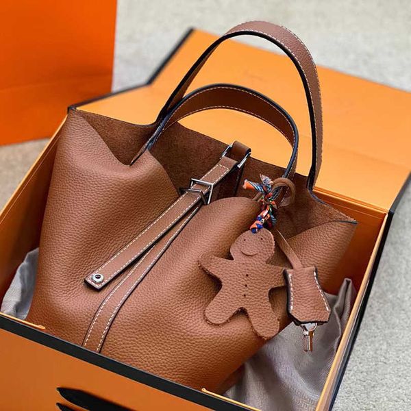 a designer tote bag her mas handbag designer bag women tote bag luxury brands vegetable handbag large capacity with silver lock and original
a designer tote bag her mas handbag designer bag women tote bag luxury brands vegetable handbag large capacity with silver lock and original