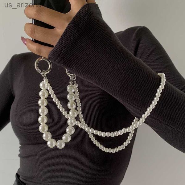 fashion trend double layer imitation pearl mobile phone chain women's temperament u-shaped tassel wrist anti-lost accessories l230620, Silver
fashion trend double layer imitation pearl mobile phone chain women's temperament u-shaped tassel wrist anti-lost accessories l230620, Silver