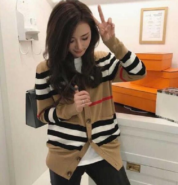 2023 women's sweater women jacket cashmere cardigan mid-length knitted v-neck loose striped sweater thin ladies trench coat 201127, White;black
2023 women's sweater women jacket cashmere cardigan mid-length knitted v-neck loose striped sweater thin ladies trench coat 201127, White;black