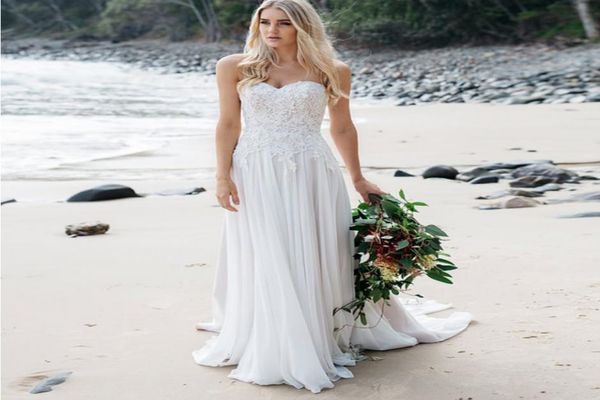 strapless fitted waist wedding gown with soft flowing chiffon skirt with train delicate lace and pearl detailing beach bridal dres1625998, White 
strapless fitted waist wedding gown with soft flowing chiffon skirt with train delicate lace and pearl detailing beach bridal dres1625998, White