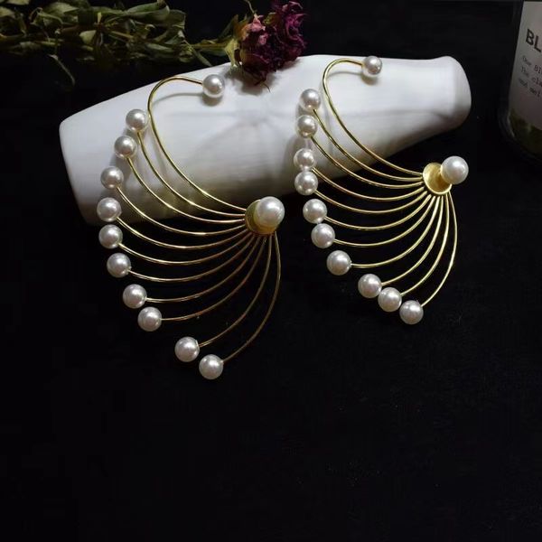 european and american magazine style exaggerated pearl fireworks fan shaped earrings with super internet red runway style earrings, Silver
european and american magazine style exaggerated pearl fireworks fan shaped earrings with super internet red runway style earrings, Silver