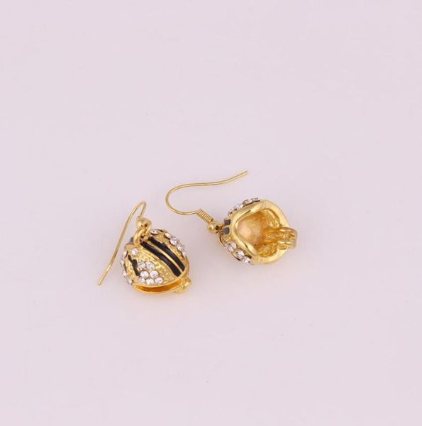 good quality helmet charm pendant studded with crystal black enamel gold color earrings3697633, Golden
good quality helmet charm pendant studded with crystal black enamel gold color earrings3697633, Golden