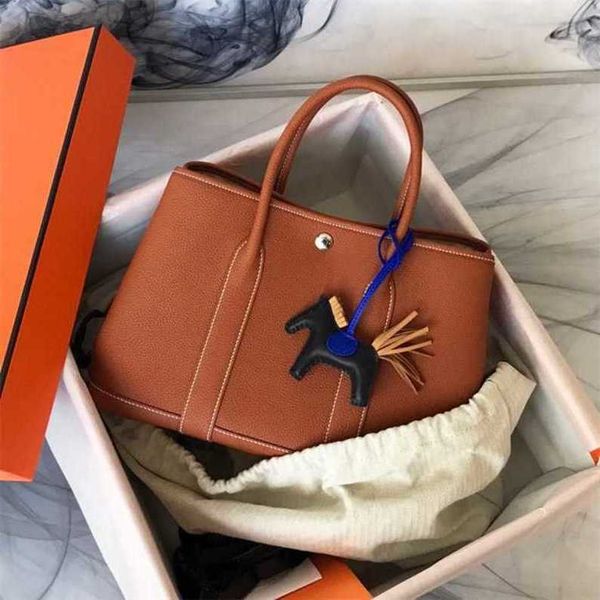 authentic handbag designer garden party tote bag handmade line party bag cowhide business handbag leisure commuter tote women's bag
authentic handbag designer garden party tote bag handmade line party bag cowhide business handbag leisure commuter tote women's bag