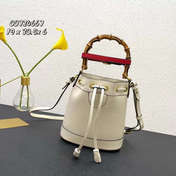 mini-bucket bag combines bamboo handle and double g real leather material with leather decorative belt to form an interesting and elegant te
mini-bucket bag combines bamboo handle and double g real leather material with leather decorative belt to form an interesting and elegant te