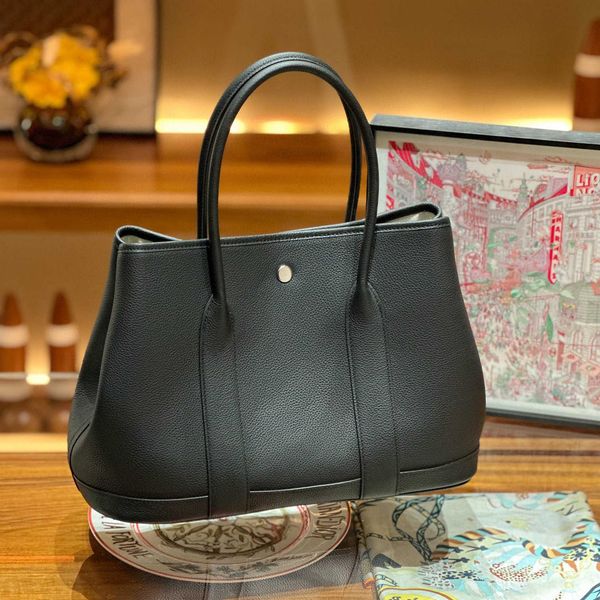 classic tote bags garden party quality garden high bag leather togo layer cowhide lychee pattern women's handbag simple tote shopping 0
classic tote bags garden party quality garden high bag leather togo layer cowhide lychee pattern women's handbag simple tote shopping 0