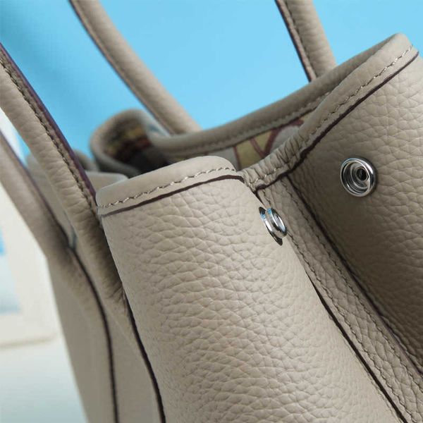classic tote bags garden party litchi grain layer cowhide garden bag large capacity fashion tote leather lady handbag wide shoulder strap zb
classic tote bags garden party litchi grain layer cowhide garden bag large capacity fashion tote leather lady handbag wide shoulder strap zb