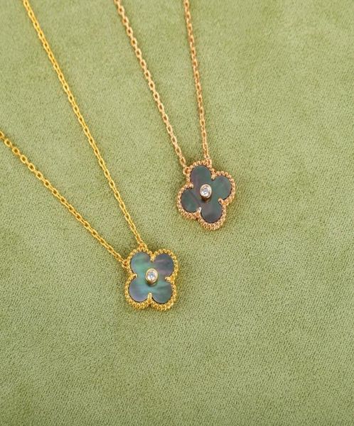 june new style natural gray fritillaria fourleaf clover necklace classic temperament color matching highquality silver necklace1227936
june new style natural gray fritillaria fourleaf clover necklace classic temperament color matching highquality silver necklace1227936
