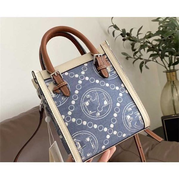 designer bag 2024 early launch new women's tb music score old flower canvas mini tote one shoulder crossbody high grade feeling small s
designer bag 2024 early launch new women's tb music score old flower canvas mini tote one shoulder crossbody high grade feeling small s
