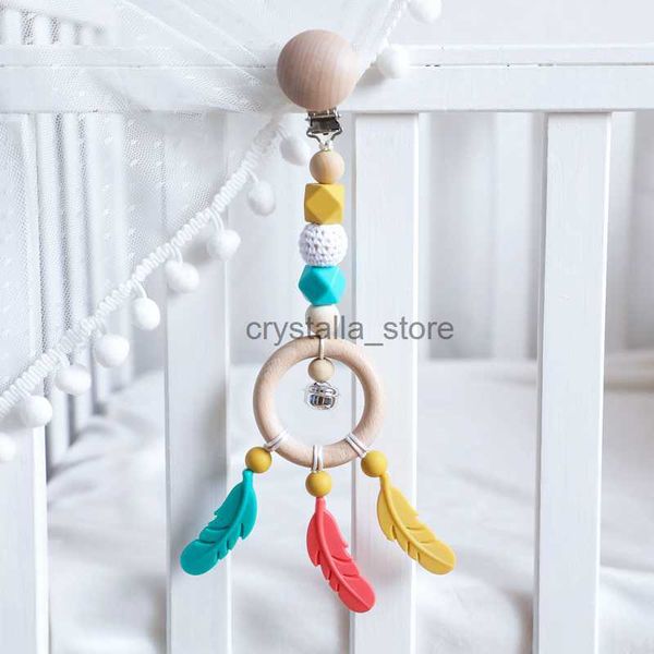 1pc baby stroller chain wooden ring baby rattles bpa silicone feather pendant infant room hanging bed bell make noise toys hkd230817
1pc baby stroller chain wooden ring baby rattles bpa silicone feather pendant infant room hanging bed bell make noise toys hkd230817