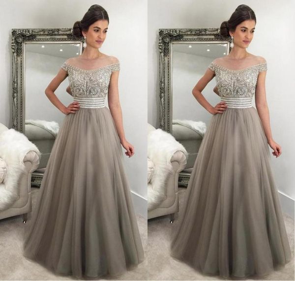 2017 elegant silver gray evening dresses off shoulder cap sleeves crystal beaded tulle puffy saudi arabic formal evening gowns pro1420148, Black;red
2017 elegant silver gray evening dresses off shoulder cap sleeves crystal beaded tulle puffy saudi arabic formal evening gowns pro1420148, Black;red