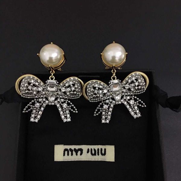 brand designer miumiu fashion earrings new pearl bow women's flash diamond exaggerated fashion temperament pearl bow earrings valentine, Golden
brand designer miumiu fashion earrings new pearl bow women's flash diamond exaggerated fashion temperament pearl bow earrings valentine, Golden