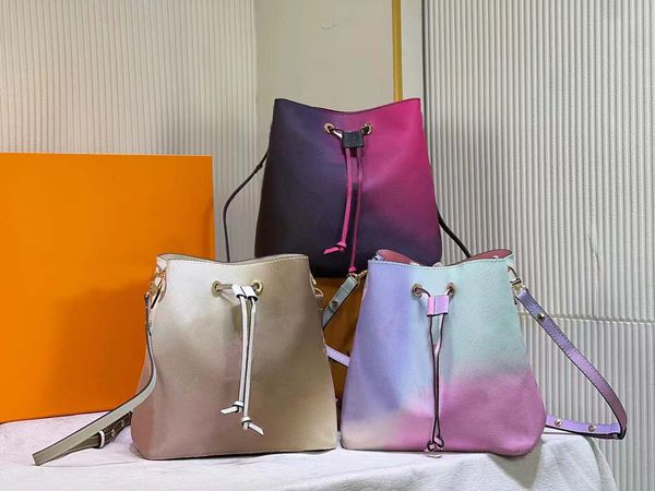 bucket bag with coated canvas fabric, colored leather trim, gold metal ornaments, adjustable long bag with zipper and inner bag with snap fa
bucket bag with coated canvas fabric, colored leather trim, gold metal ornaments, adjustable long bag with zipper and inner bag with snap fa