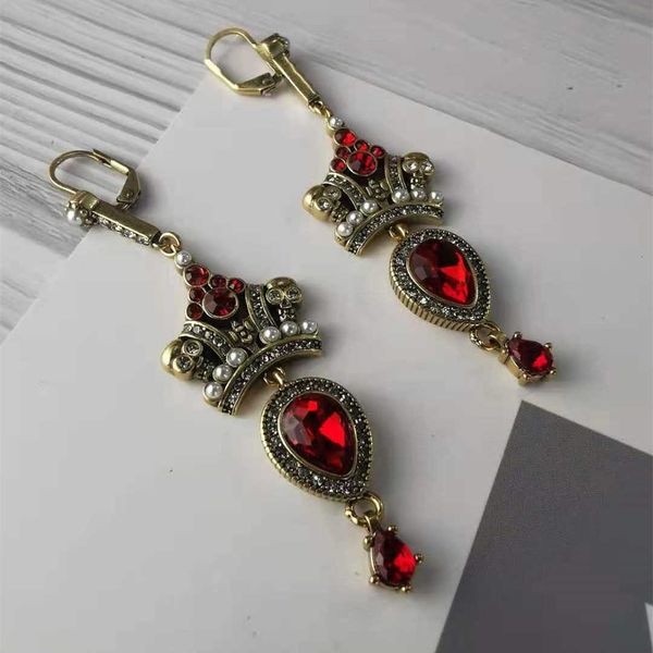 fashion designer alexander queen crown pearl red diamond earhook baroque diamond red skeleton pendant earrings, Golden
fashion designer alexander queen crown pearl red diamond earhook baroque diamond red skeleton pendant earrings, Golden