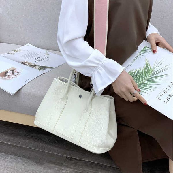 garden bag authentic party tote handbag leather designer cowhide commuter women's large capacity high sense
garden bag authentic party tote handbag leather designer cowhide commuter women's large capacity high sense